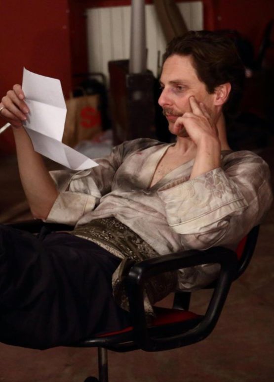 Antonio Pauletta, actor, on the set of King Pest, by Alessandro Redaelli, in full costume, reviewing the script.